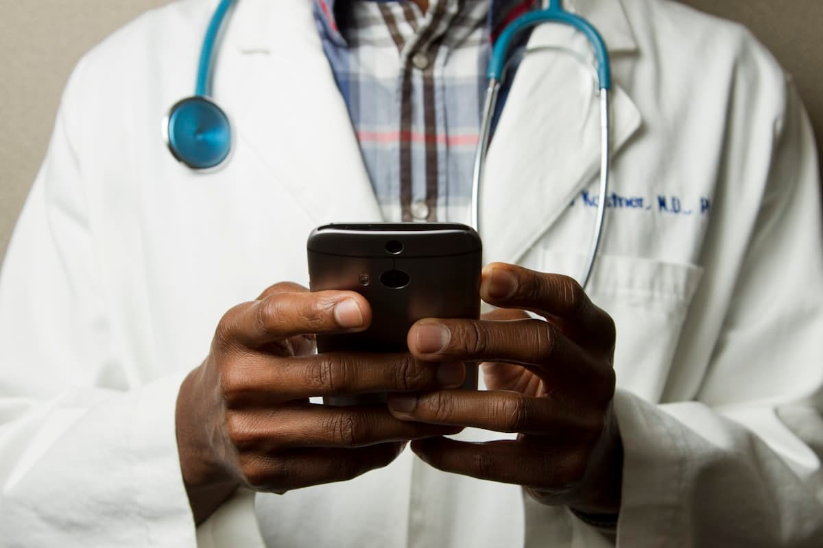 Practice manager reviewing healthcare compliance checklist on computer screen